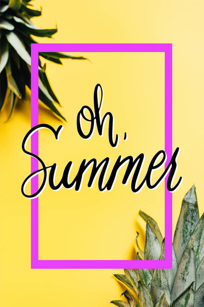 selective focus of green pineapple leaves on yellow background with oh summer illustration