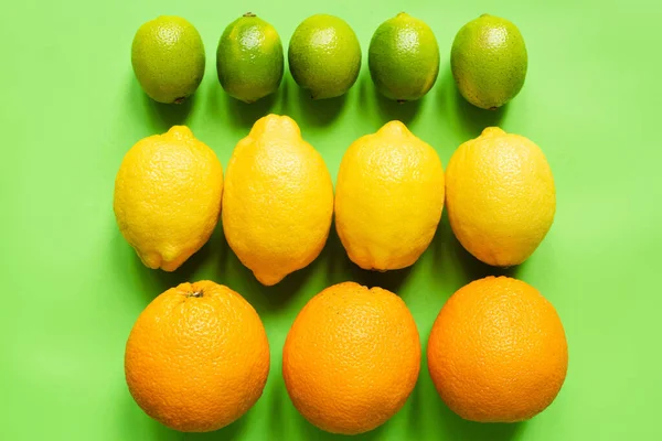 Top View Ripe Lemons Oranges Limes Green Background — Stock Photo, Image