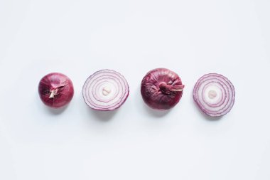 top view of cut and whole red onion on white background clipart