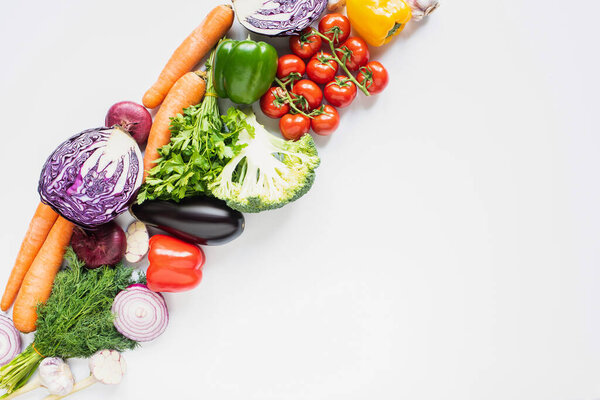 top view of fresh ripe colorful vegetables on white background