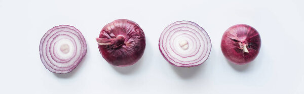 top view of cut and whole red onion on white background, panoramic shot