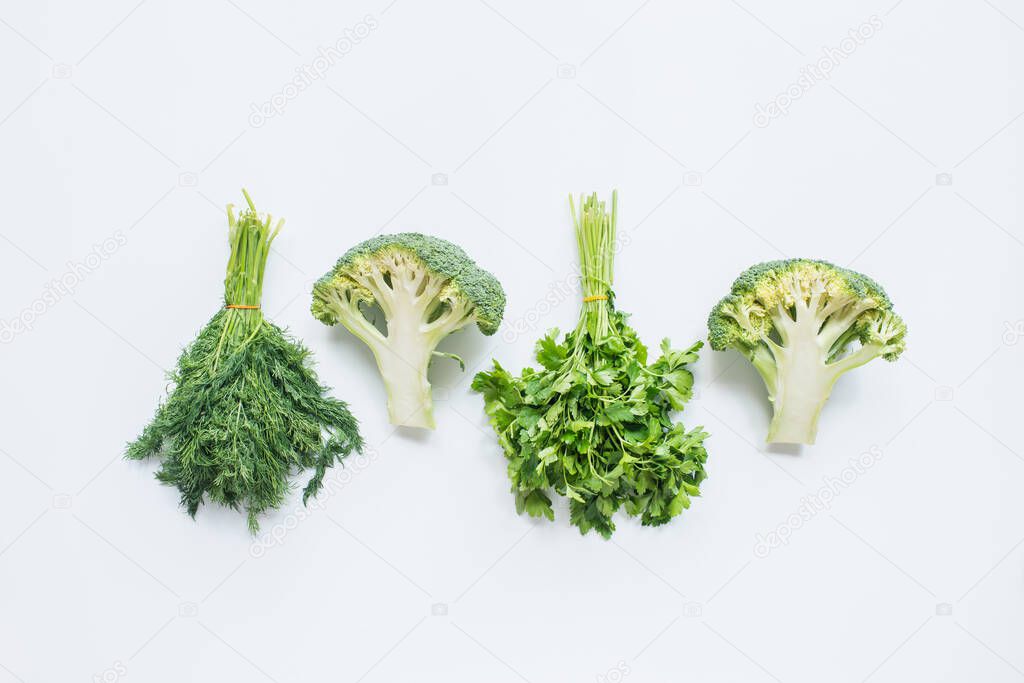 flat lay with assorted green vegetables on white background