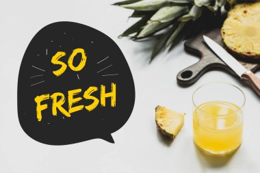 delicious pineapples on wooden cutting board with knife near glass of orange juice and so fresh lettering on white  clipart