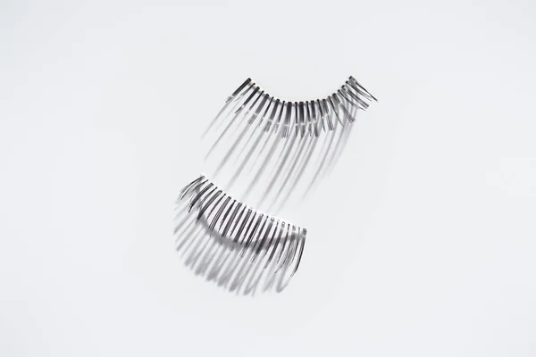 Set of long fake eyelashes on white background — Stock Photo