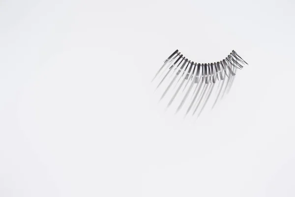 Single piece of eyelashes on white background — Stock Photo