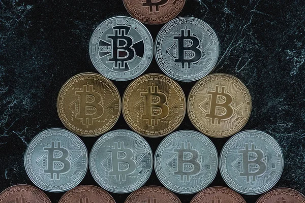 Top view of arranged various bitcoins on marble tabletop — Stock Photo