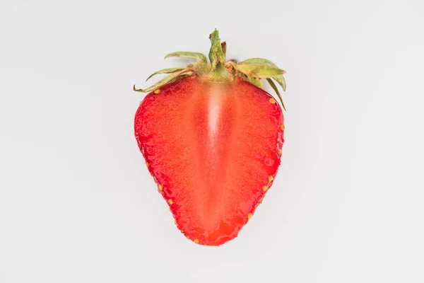 Single cut strawberry isolated on white background — Stock Photo