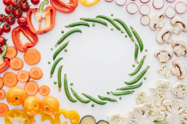 Top view of fresh raw organic vegetables isolated on white background — Stock Photo