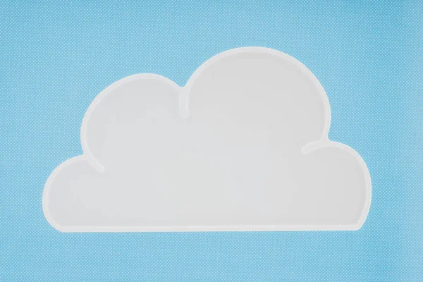 Top view of white napkin in shape of cloud isolated on blue — Stock Photo
