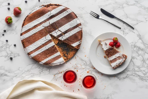 Top view of tasty homemade cake with strawberries and blueberries on marble surface — Stock Photo