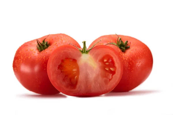 Close up view of arranged fresh tomatoes isolated on white — Stock Photo