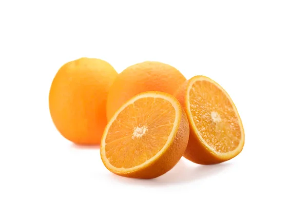 Close up view of wholesome and cut oranges isolated on white — Stock Photo