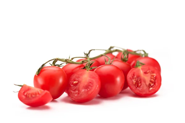 Close up view of fresh cherry tomatoes on twig isolated on white — Stock Photo