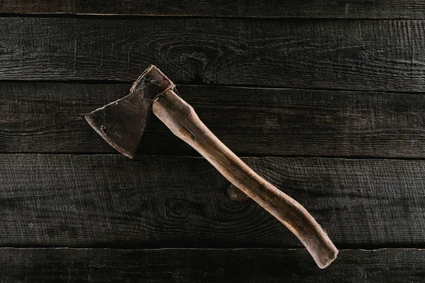 Top view of vintage axe on wooden tabletop background — Stock Photo