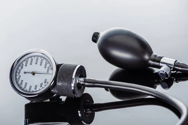 Close up view of device for measuring pressure on glass surface — Stock Photo