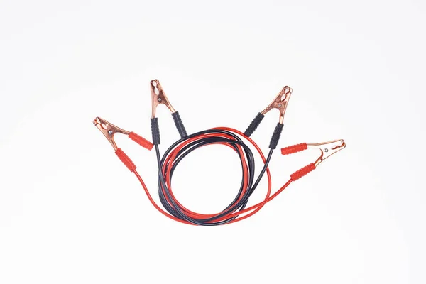 Top view of arranged jump start cables isolated on white — Stock Photo