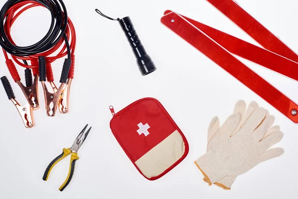 Flat lay with first aid kit and automotive accessories isolated on white — Stock Photo