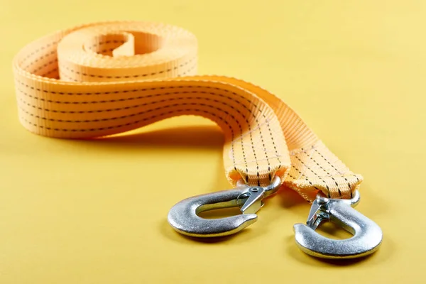 Close up view of car tow rope on yellow background — Stock Photo