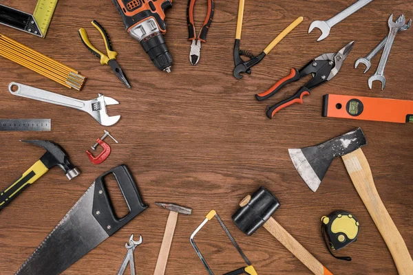 Top view of arranged various tools on wooden table — Stock Photo