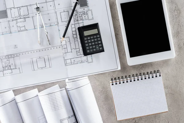 Top view of architect workplace with blueprint, divider and digital tablet with blank screen — Stock Photo