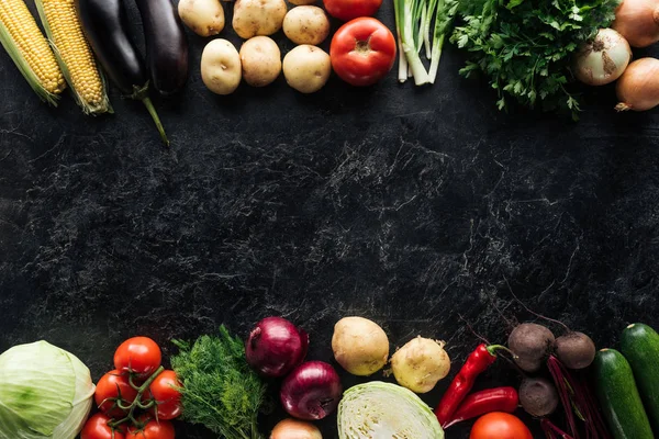 Flat lay with food composition of autumn harvest on black marble surface — Stock Photo