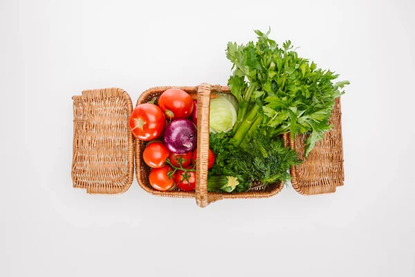 Top view of raw autumn vegetables in basket isolated on white — Stock Photo