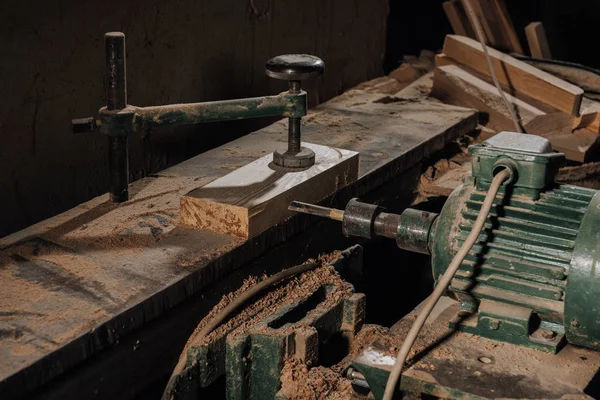 Close up view of woodworkers workplace with equipment and wood at workshop — Stock Photo