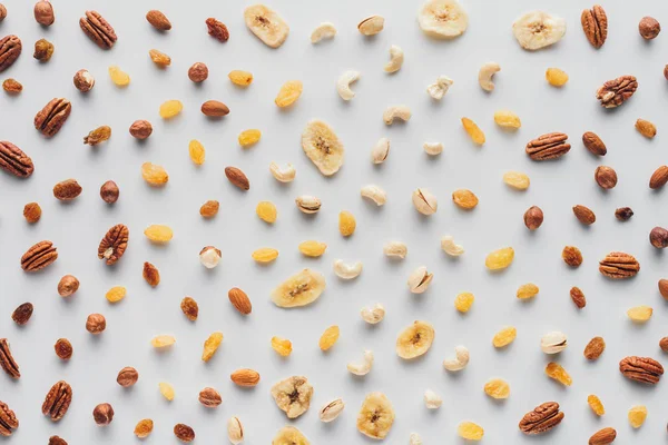 Flat lay with mix of dried fruits and nuts isolated on white background — Stock Photo