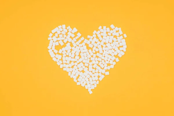 Top view of heart of marshmallows isolated on orange — Stock Photo
