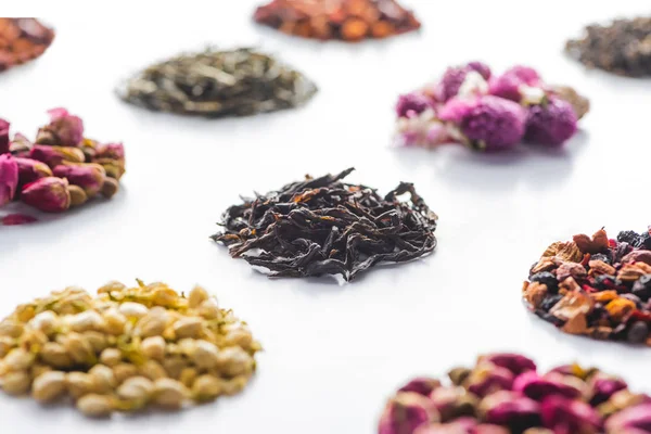 Set of dried herbal healthy tea on white surface — Stock Photo