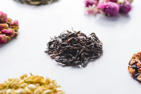 Set of dried herbal organic tea on white surface — Stock Photo