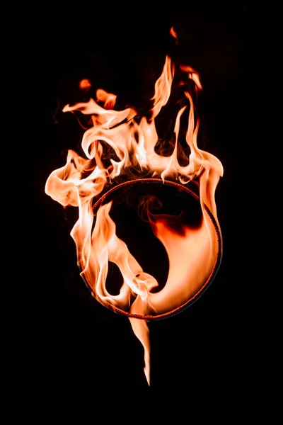 Close up view of burning circle figure isolated on black — Stock Photo