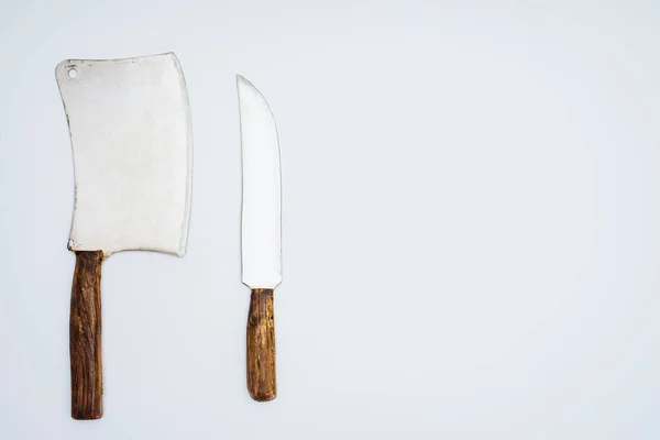 Set various kitchen knives with wooden handles isolated on grey, top view — Stock Photo