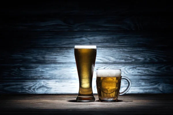 Beer in different glasses on wooden table, oktoberfest concept — Stock Photo