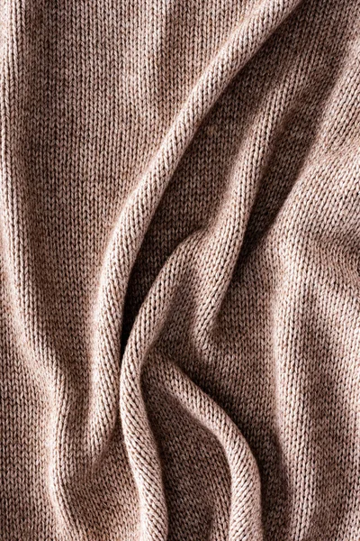 Full frame of folded knitted cloth as background — Stock Photo