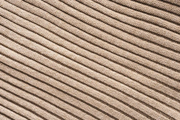 Full frame of beige woolen fabric with pattern background — Stock Photo
