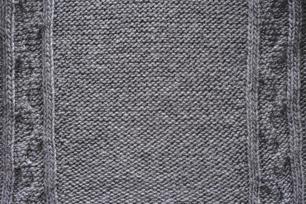 Vue rapprochée du tissu tricoté gris comme toile de fond — Photo de stock