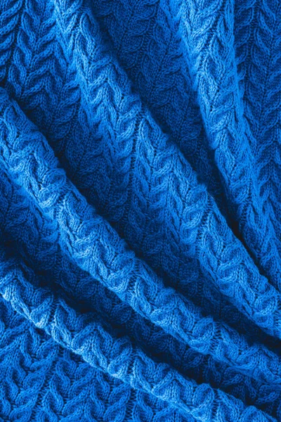 Full frame of folded dark blue woolen fabric with pattern as backdrop — Stock Photo