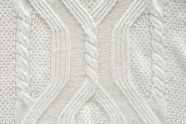 Cornice completa di tessuto bianco lavorato a maglia con motivo come sfondo — Foto stock
