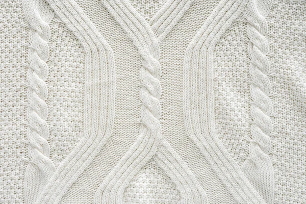 Full frame of white knitted cloth with pattern as background — Stock Photo