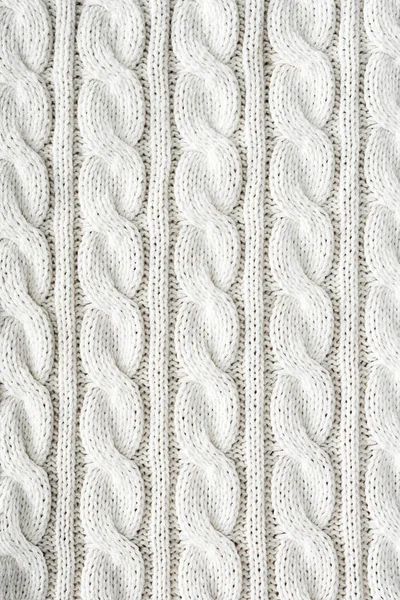 Plein cadre de tissu tricoté blanc avec motif comme fond — Photo de stock