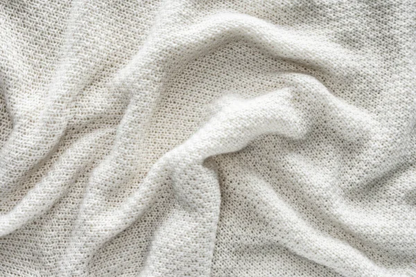 Plein cadre de tissu tricoté blanc ondulé comme fond — Photo de stock