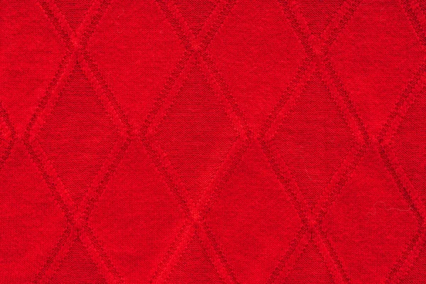 Vue rapprochée du tissu de laine rouge avec motif comme toile de fond — Photo de stock