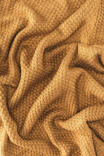 Full frame of folded brown textured fabric as backdrop — Stock Photo