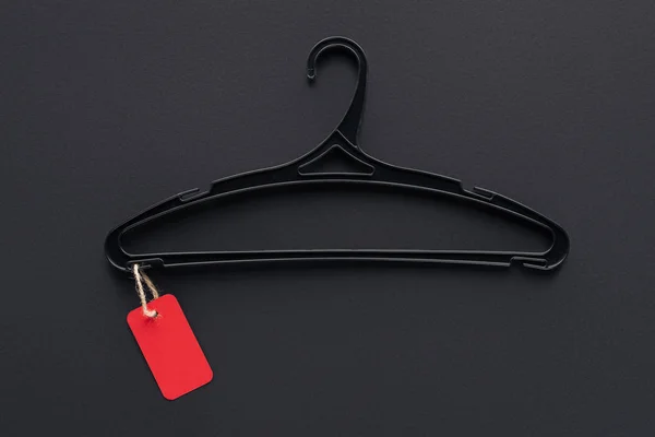 Top view of hanger with red sale tag for special offer on black friday — Stock Photo