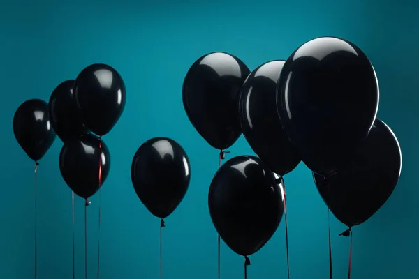 Black balloons on blue for special offer on black friday — Stock Photo