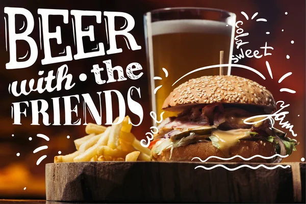 Tasty burger with turkey, french fries and glass of beer with 