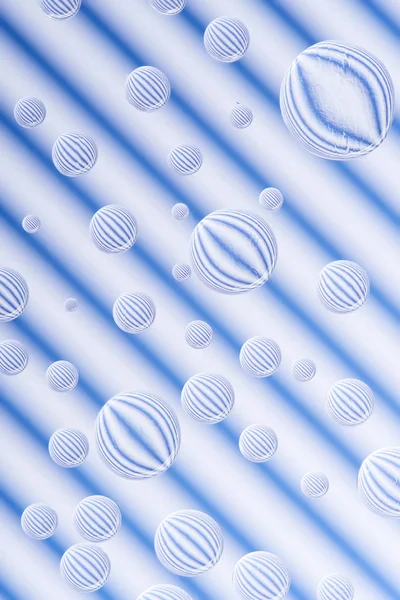 Beautiful calm clean water drops on striped white and blue background — Stock Photo
