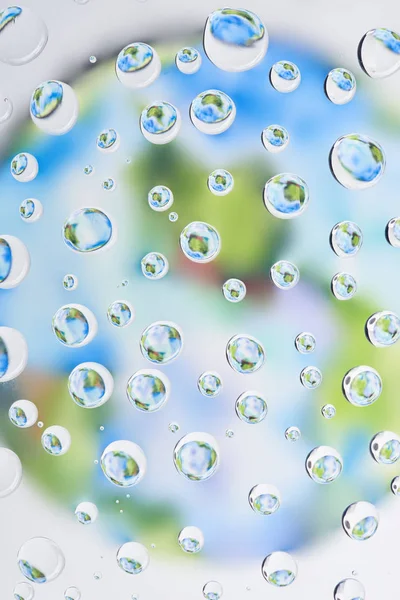 Beautiful clear water drops on blurred abstract background — Stock Photo