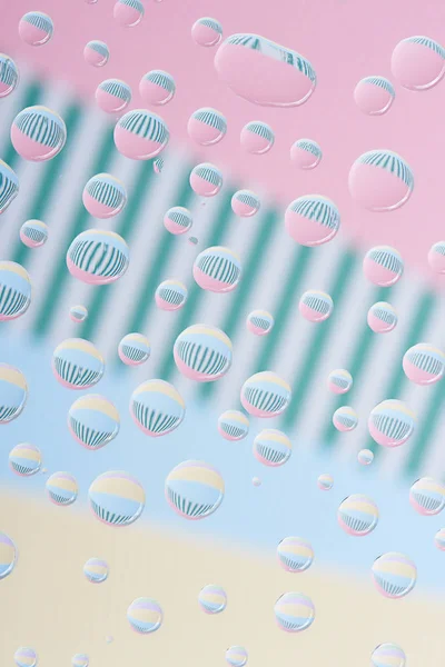 Close-up view of transparent droplets on light abstract background — Stock Photo